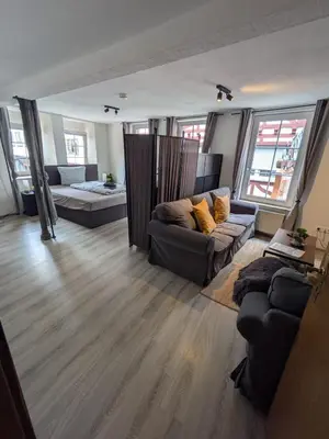 Ein Bett oder Betten in einem Zimmer der Unterkunft FeWo Innenstadt mit Parkplatz in 200m Entfernung bis 4 Personen, 80m bis Markplatz