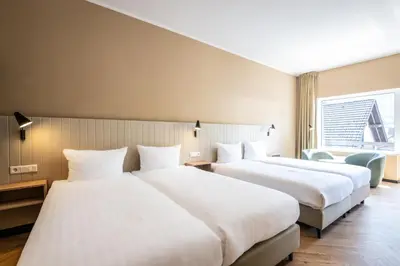 Ein Bett oder Betten in einem Zimmer der Unterkunft May Hotel Mayschoß