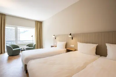 Ein Bett oder Betten in einem Zimmer der Unterkunft May Hotel Mayschoß
