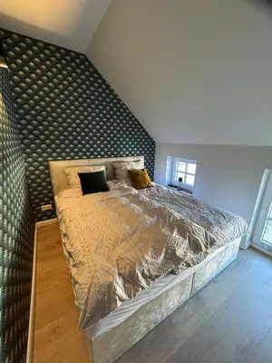 Ein Bett oder Betten in einem Zimmer der Unterkunft Modernes Appartement am Luisenhof