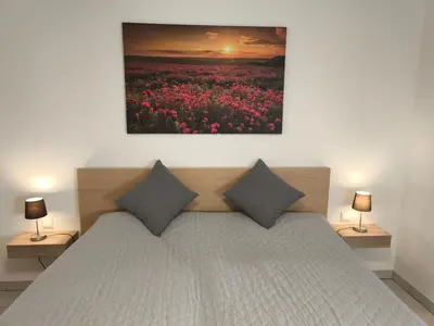 Ein Bett oder Betten in einem Zimmer der Unterkunft Ferienwohnung Ries am Weinberg