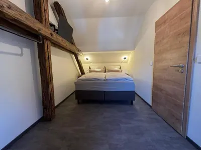 Ein Bett oder Betten in einem Zimmer der Unterkunft Pinnerbergstube Ferienwohnung Cochem Mosel