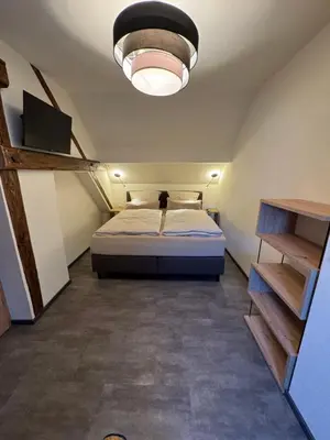 Ein Bett oder Betten in einem Zimmer der Unterkunft Pinnerbergstube Ferienwohnung Cochem Mosel