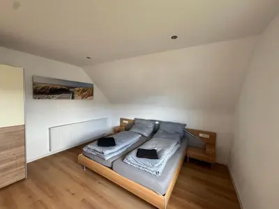 Ein Bett oder Betten in einem Zimmer der Unterkunft Ferienwohnung am sonnigen Südhang
