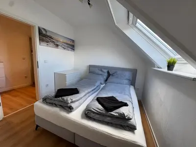 Ein Bett oder Betten in einem Zimmer der Unterkunft Ferienwohnung am sonnigen Südhang