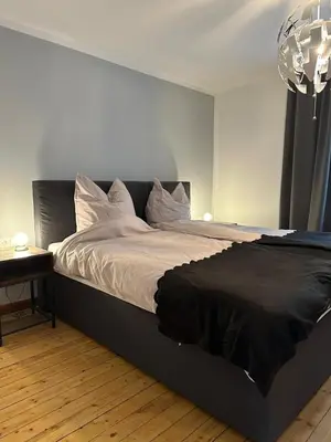 Ein Bett oder Betten in einem Zimmer der Unterkunft Trappe's Maar-Häuschen