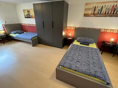 Ein Bett oder Betten in einem Zimmer der Unterkunft Team Haus für 11 Personen
