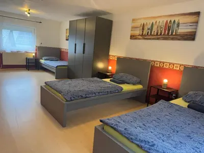 Ein Bett oder Betten in einem Zimmer der Unterkunft Team Haus für 11 Personen
