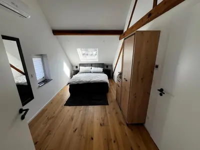 Ein Bett oder Betten in einem Zimmer der Unterkunft Moselzeit - Ferienwohnung 