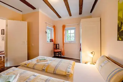 Ein Bett oder Betten in einem Zimmer der Unterkunft Kavaliershäuschen - Urlaub auf dem Weingut