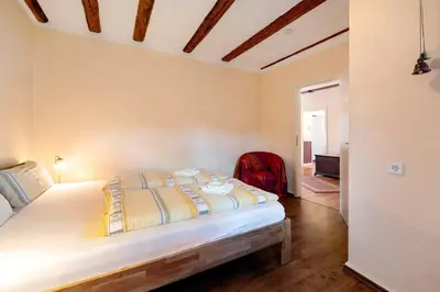 Ein Bett oder Betten in einem Zimmer der Unterkunft Kavaliershäuschen - Urlaub auf dem Weingut