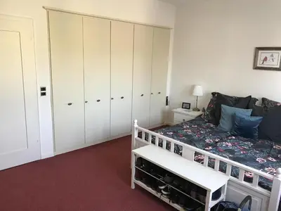 Ein Bett oder Betten in einem Zimmer der Unterkunft Ferienhaus Goethe