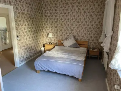 Ein Bett oder Betten in einem Zimmer der Unterkunft Ferienhaus Goethe