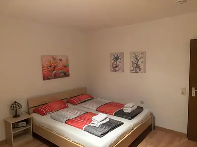 Ein Bett oder Betten in einem Zimmer der Unterkunft Ferienwohnungen im Taunusblick
