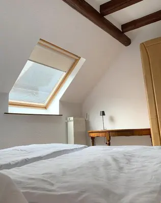 Ein Bett oder Betten in einem Zimmer der Unterkunft Moselbleibe Mainzer