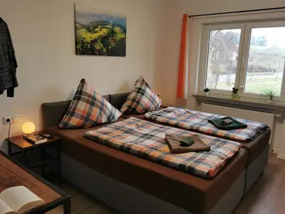 Ein Bett oder Betten in einem Zimmer der Unterkunft Speedy's Gästehaus