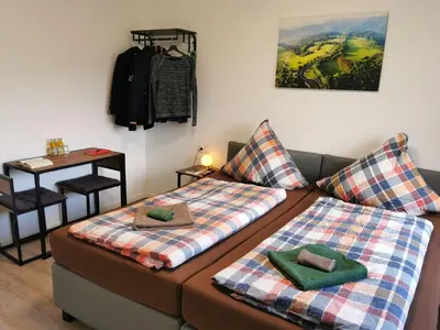 Ein Bett oder Betten in einem Zimmer der Unterkunft Speedy's Gästehaus