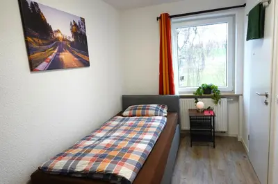 Ein Bett oder Betten in einem Zimmer der Unterkunft Speedy's Gästehaus