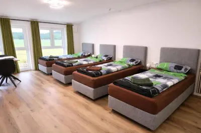 Ein Bett oder Betten in einem Zimmer der Unterkunft Speedy's Gästehaus