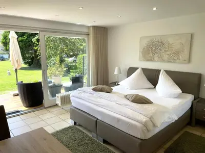 Ein Bett oder Betten in einem Zimmer der Unterkunft Ferienwohnungen Lohmann