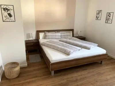 Ein Bett oder Betten in einem Zimmer der Unterkunft Quellenweg
