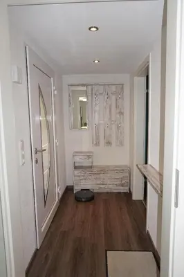 Ein Bett oder Betten in einem Zimmer der Unterkunft Ferienwohnung Am alten Holzweg