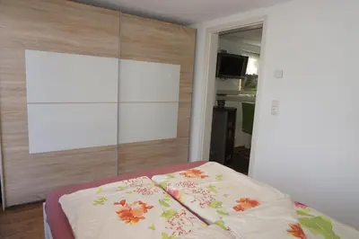 Ein Bett oder Betten in einem Zimmer der Unterkunft Ferienwohnung Am alten Holzweg