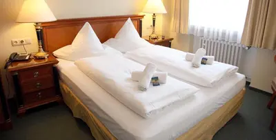 Ein Bett oder Betten in einem Zimmer der Unterkunft Laacher Lay Hotel