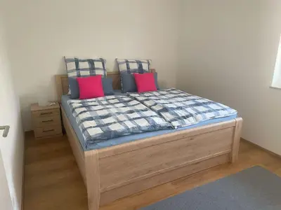 Ein Bett oder Betten in einem Zimmer der Unterkunft Ferienwohnung Kostecki