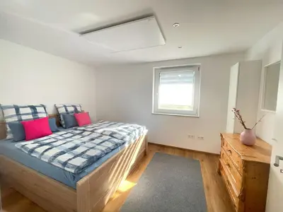 Ein Bett oder Betten in einem Zimmer der Unterkunft Ferienwohnung Kostecki