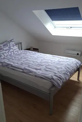 Ein Bett oder Betten in einem Zimmer der Unterkunft Ferienwohnung Vulkaneifel