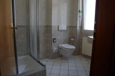 Ein Badezimmer in der Unterkunft Hotel Porta Nigra VICTUS