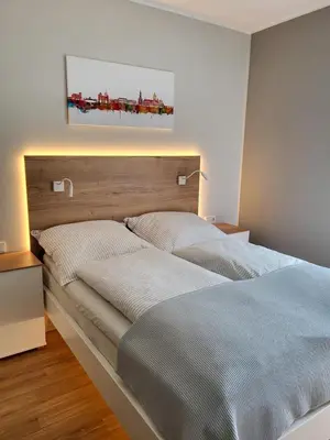 Ein Bett oder Betten in einem Zimmer der Unterkunft H-Apartments Lambertistraße