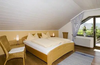 Ein Bett oder Betten in einem Zimmer der Unterkunft Ferienwohnung Panoramablick