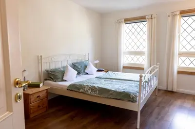 Ein Bett oder Betten in einem Zimmer der Unterkunft Am Bärenbrunnen