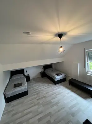 Ein Bett oder Betten in einem Zimmer der Unterkunft Monteurzimmer RLP - Ihr Zuhause auf Zeit!