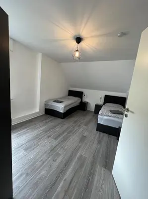 Ein Bett oder Betten in einem Zimmer der Unterkunft Monteurzimmer RLP - Ihr Zuhause auf Zeit!