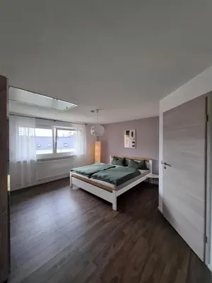 Ein Bett oder Betten in einem Zimmer der Unterkunft Ferienhaus Ewergass in Mertesdorf - nur 8 km von Trier - kostenl ÖPNV-Ticket ab 04-26