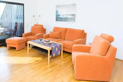 Ein Sitzbereich in der Unterkunft Ferienwohnung direkt am Rhein in Neuwied bei Koblenz