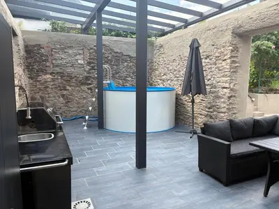 Ein Sitzbereich in der Unterkunft 1-Zimmer-Apartment mit Pool und Kamin