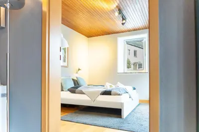 Ein Bett oder Betten in einem Zimmer der Unterkunft Haus Nürburgring I 4 Schlafzimmer für 1-10 Personen I Küche I Garten I Grillplatz