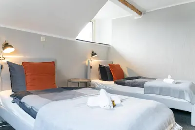 Ein Bett oder Betten in einem Zimmer der Unterkunft Haus Nürburgring I 4 Schlafzimmer für 1-10 Personen I Küche I Garten I Grillplatz