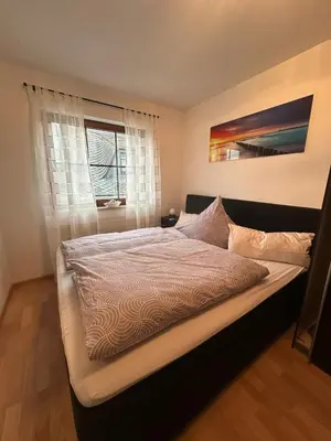 Ein Bett oder Betten in einem Zimmer der Unterkunft Ferienwohnung Katharina im Weinort an der Mosel