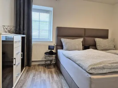 Ein Bett oder Betten in einem Zimmer der Unterkunft Eifelauszeit - Wohnung Groß