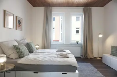 Ein Bett oder Betten in einem Zimmer der Unterkunft NEU zentrale Wohnung Netflix Balkon 4 Gäste