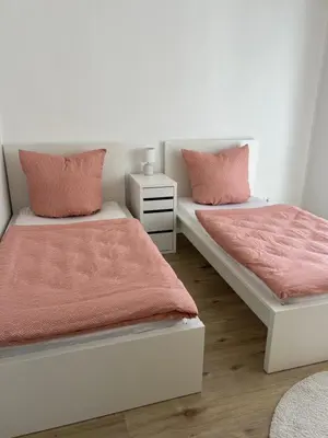 Ein Bett oder Betten in einem Zimmer der Unterkunft Ferienwohnung - Am Eisenberg