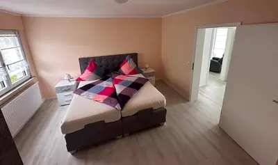 Ein Bett oder Betten in einem Zimmer der Unterkunft Ferienwohnung Hochwaldblick 4