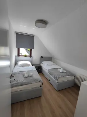Ein Bett oder Betten in einem Zimmer der Unterkunft Parkblick Apartment Weißenthurm Nähe Koblenz