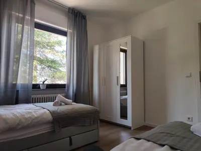 Ein Bett oder Betten in einem Zimmer der Unterkunft Parkblick Apartment Weißenthurm Nähe Koblenz