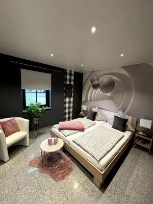 Ein Bett oder Betten in einem Zimmer der Unterkunft 5-Sterne Wohlfühl-Ferienhaus Eifellust